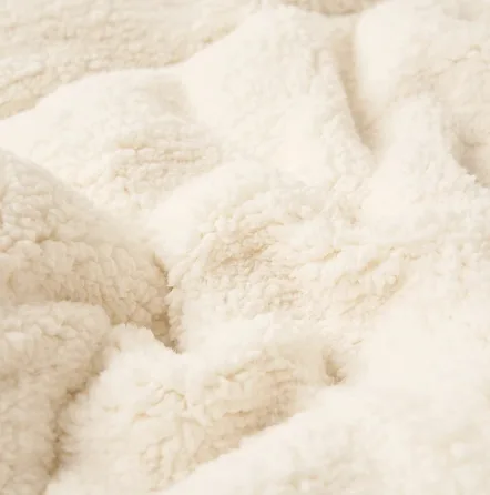 Close-up of the cream sherpa reverse