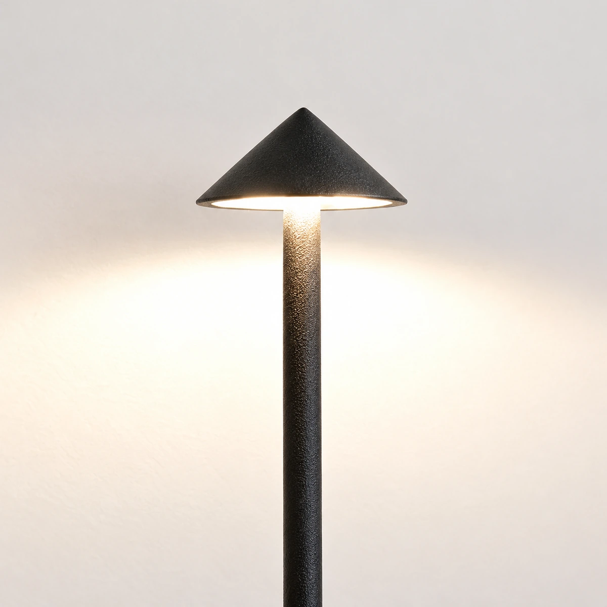 Black cone table lamp shade and light detail